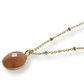 Calm citrine stone and golden pearl necklace