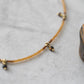 Cocoon necklace in gold and tiger eye